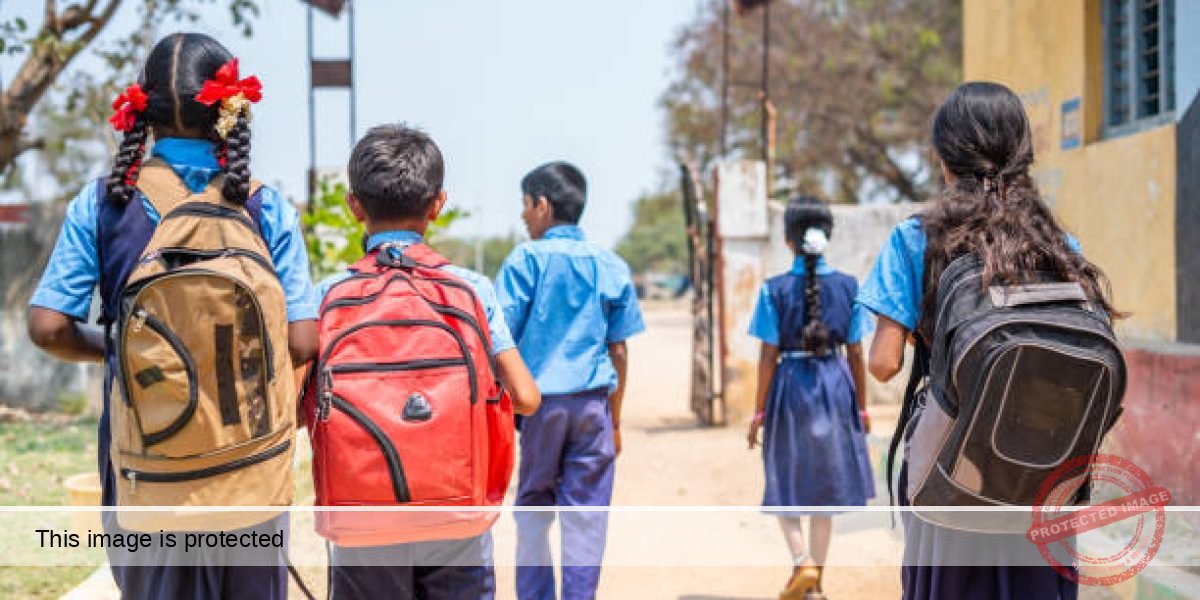 Back view shot of group of teenager kids in uniform going home from school after classes - concept of education, learning and childhood growth.